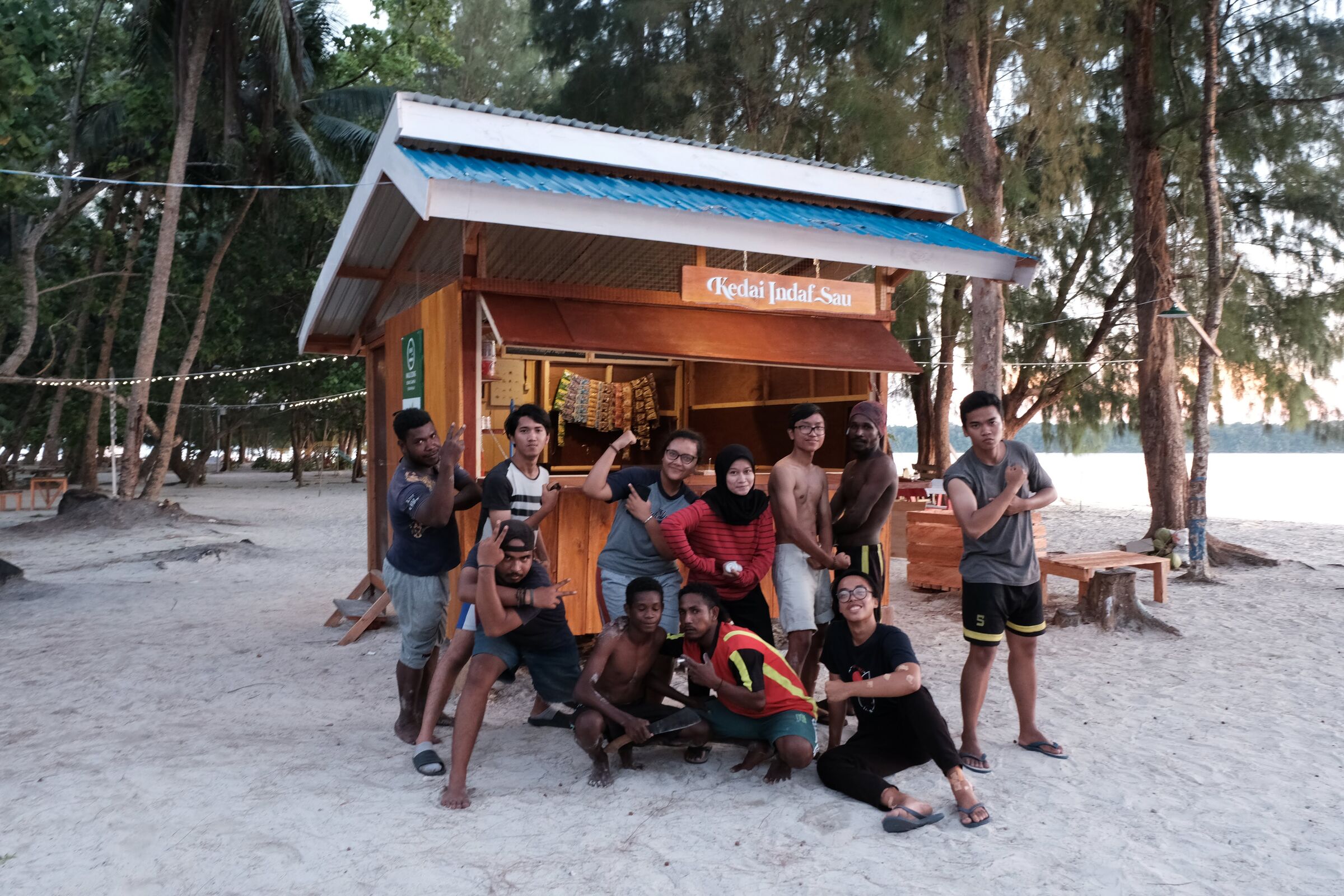 The infrastructure sub-team posing in front of Kedai Indaf-Sau